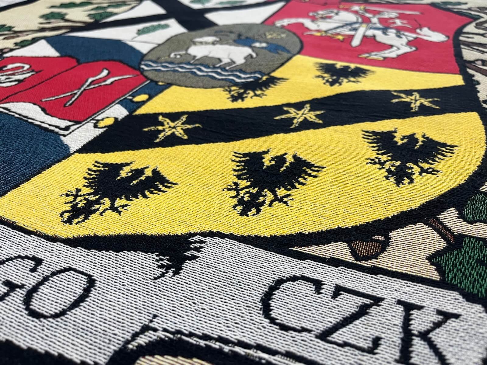 Woven coat of arms