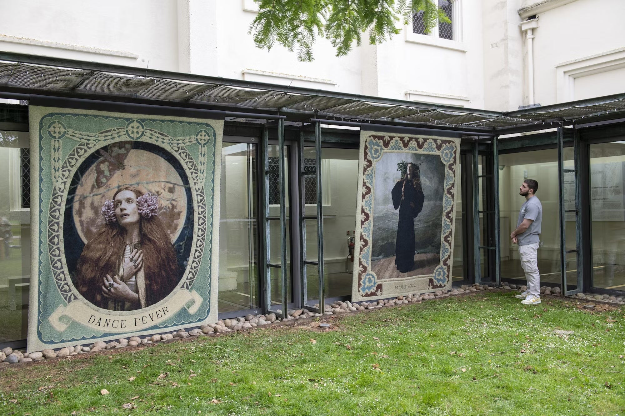 Large decorative tapestries displayed outdoors