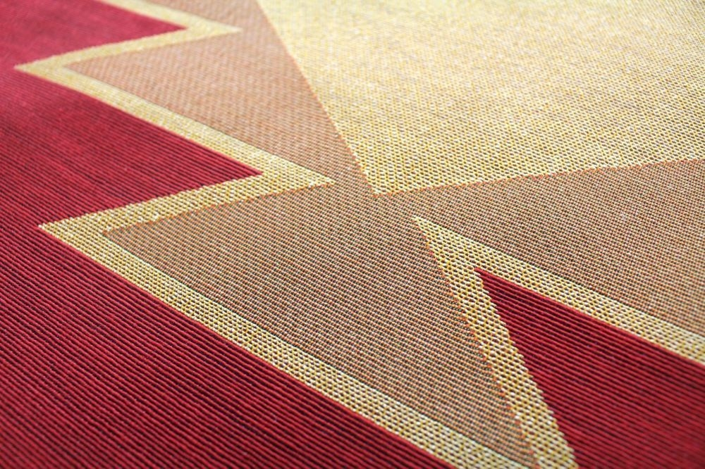 Close-up of woven geometric tapestry