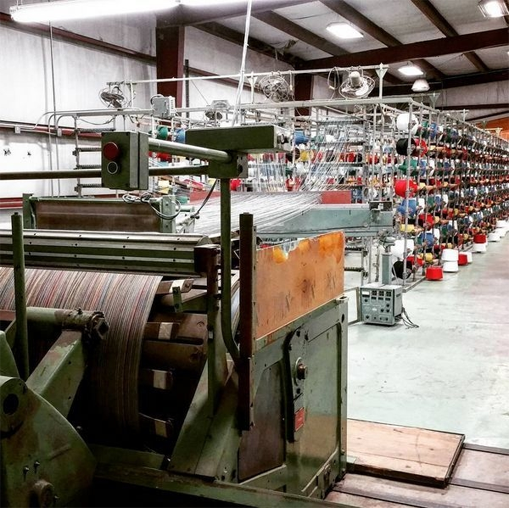 Industrial textile weaving machine