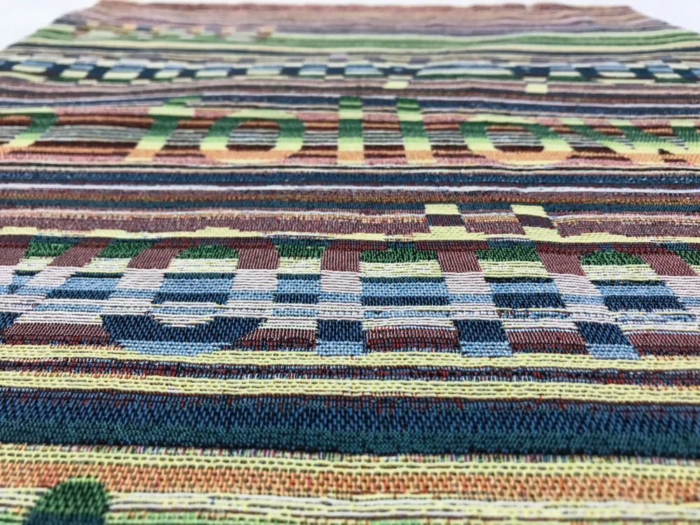 Woven fabric with text