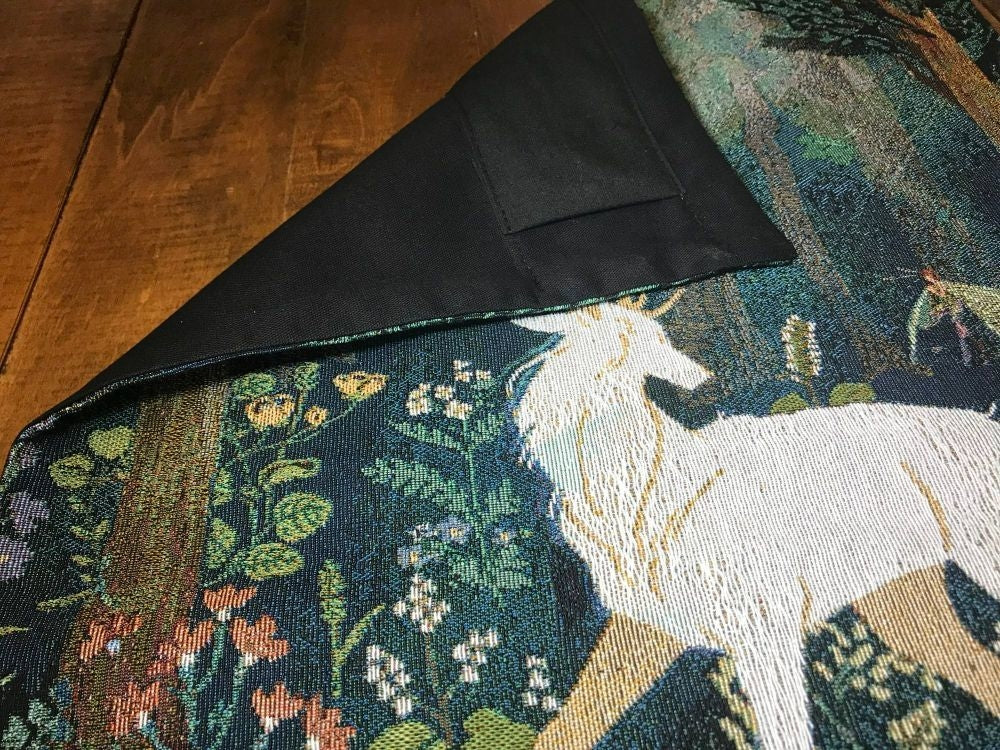 Woven tapestry with unicorn design