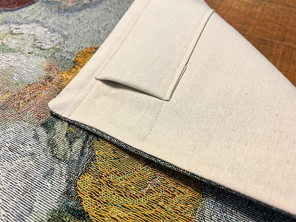 Securely stitched tapestry backing