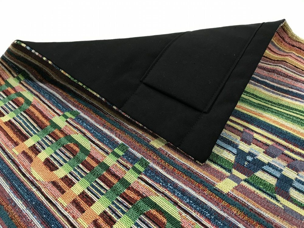 Woven textile with hanging sleeve