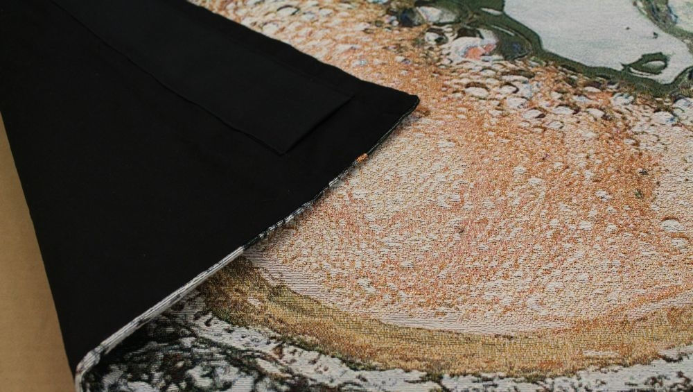 Woven textile with backing