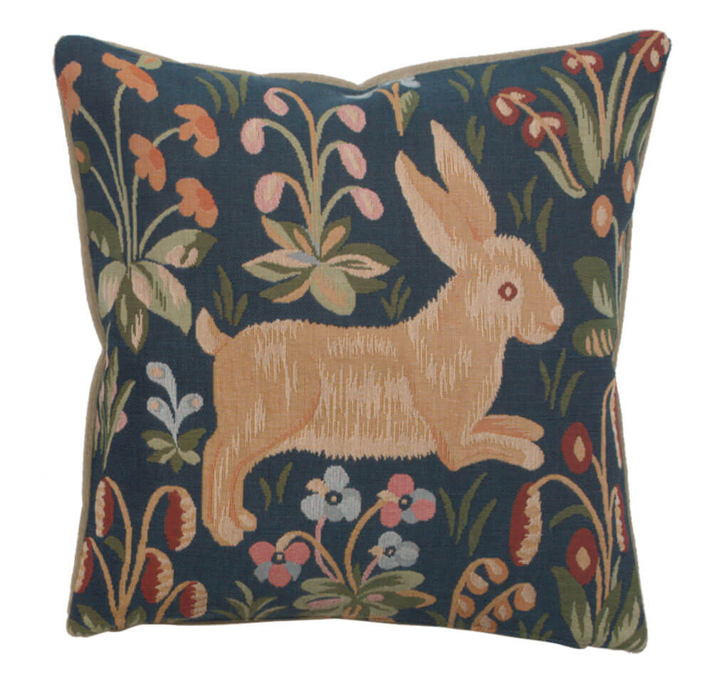 Running Rabbit in Blue pillow cover woven in France, depicting a medieval bunny rabbit frolicking amidst a floral backdrop